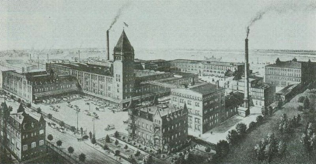 Schwarz-weiß-Illustration der frühen New York City mit Gebäuden, Bäumen, Fahrzeugen und Fabrikschloten, die Rauch ausstoßen, beschriftet mit 'New York City's First Factory' unten.