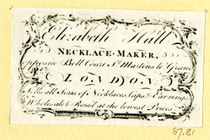 Eine alte Visitenkarte mit einem Foto eines Schmuckherstellers und Text, der seine Dienstleistungen beschreibt.