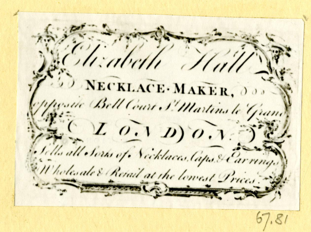 Eine alte Visitenkarte mit einem Foto eines Schmuckherstellers und Text, der seine Dienstleistungen beschreibt.