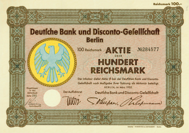 Eine alte deutsche Banknote mit einer Vogeldarstellung und der Inschrift "Deutsche Bank und Disconto-Gefellichaft Berlin".