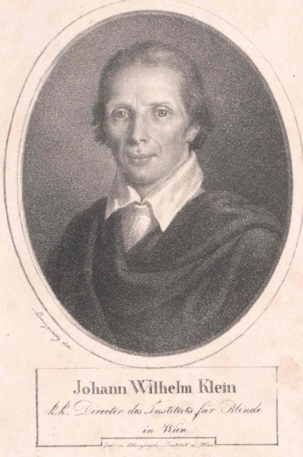 Schwarz-weiß-Porträt von Johann Wilhelm Klein, Direktor des Instituts für Blinde in Wien, in weißem Hemd und ernstem Gesichtsausdruck, mit deutschem Text unten.