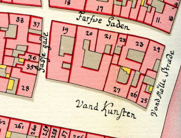 Ein altes Stadtplan von Vand Kunften, Deutschland, mit einem roten und pinkfarbenen Farbschema, das Straßen, Gebäude und Sehenswürdigkeiten zeigt, mit Text, der die Straßennamen und Gebäudestandorte angibt.